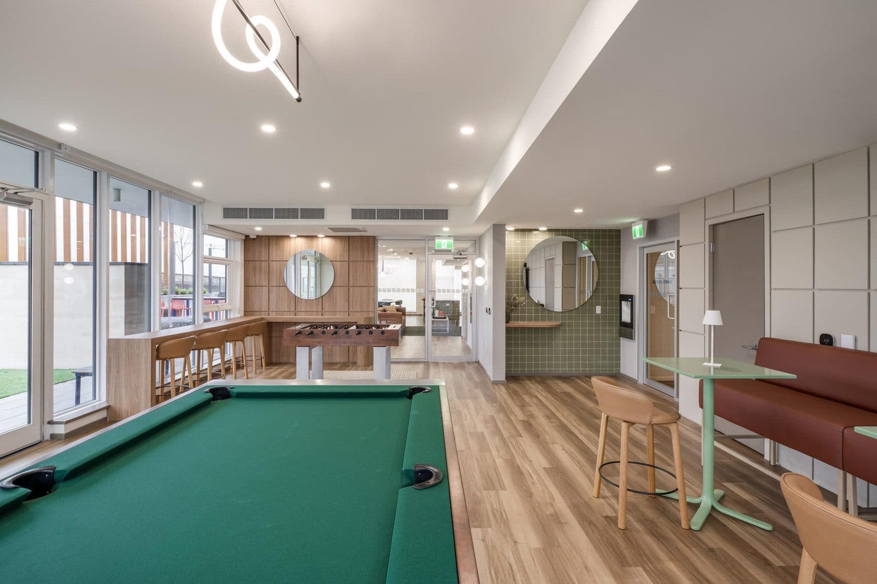 The games room at Signal, with a pool table and banquette seating