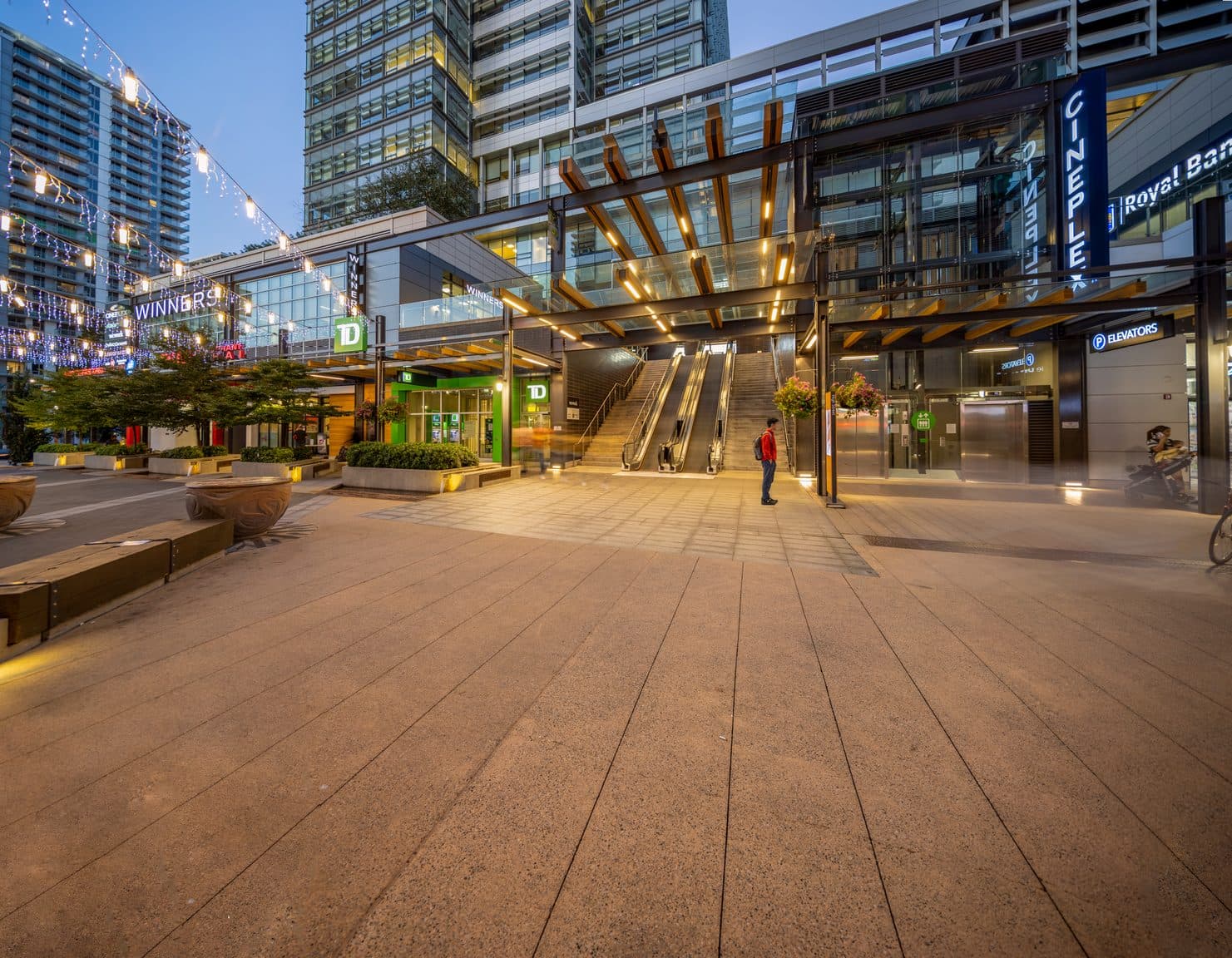 The Marine Gateway plaza at dusk, a two-minute walk from Signal