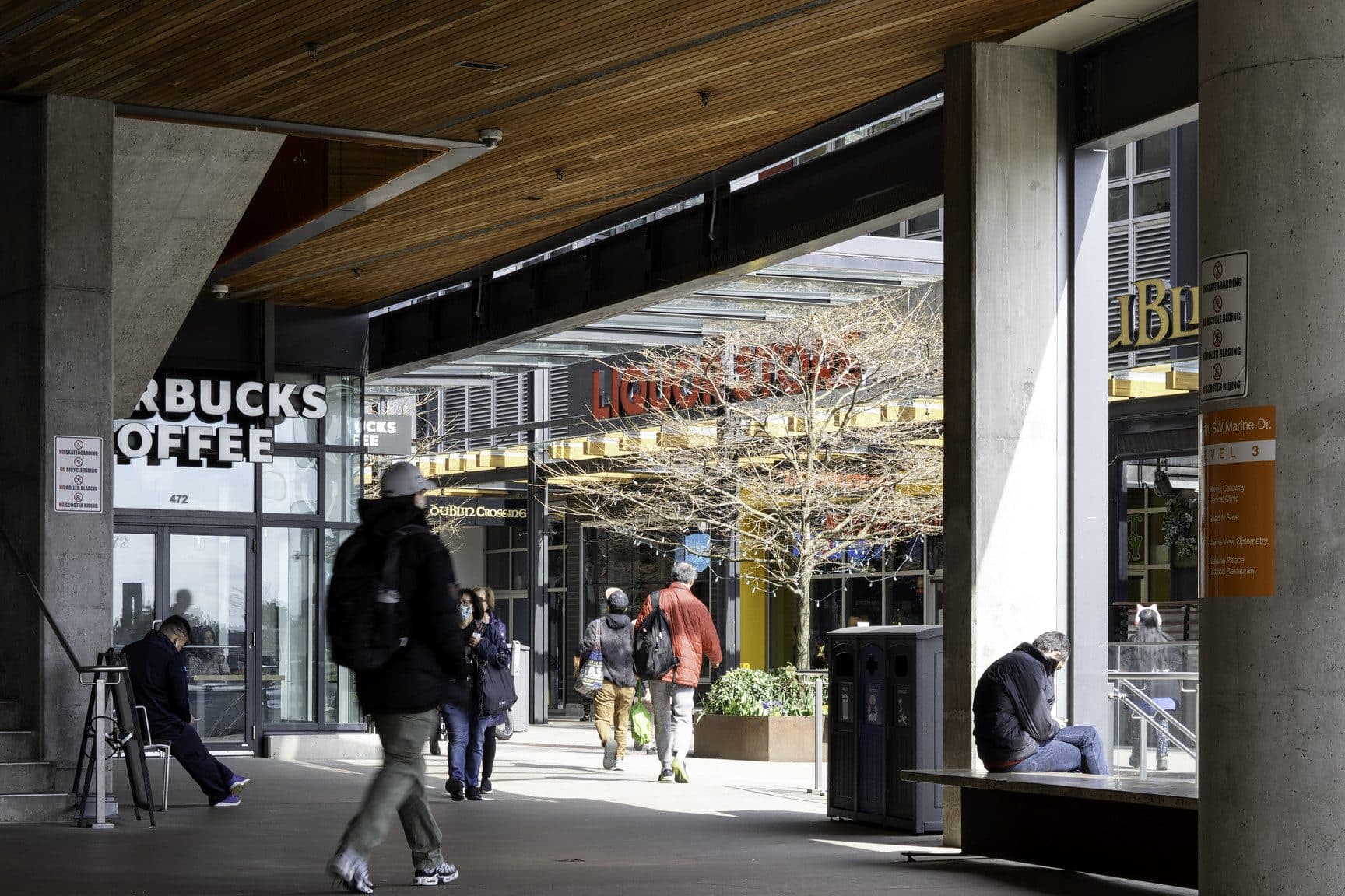 Shops and cafés under the Marine Gateway canopy
