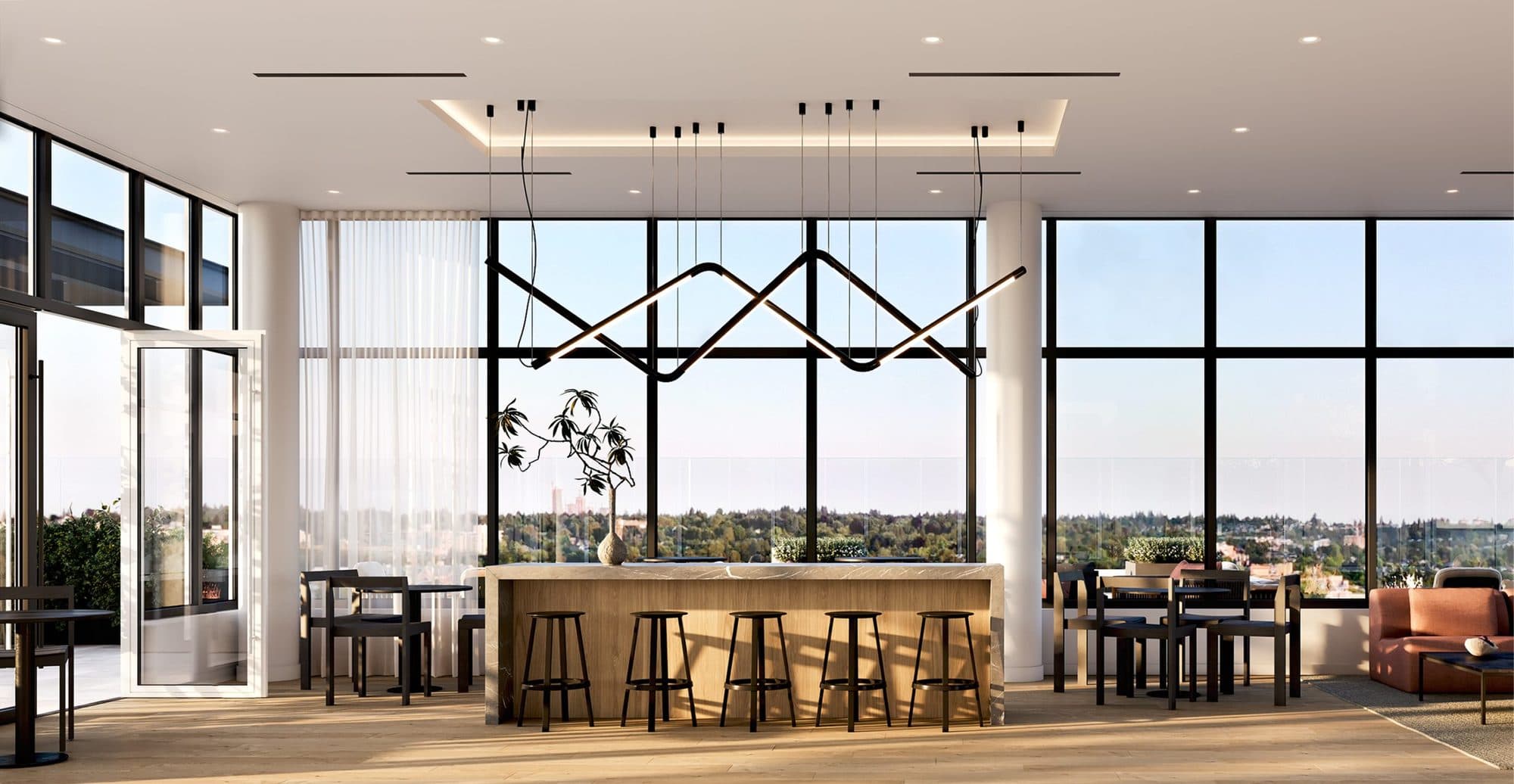 The rooftop lounge at West 42, with long tables and bar seating under floor-to-ceiling windows