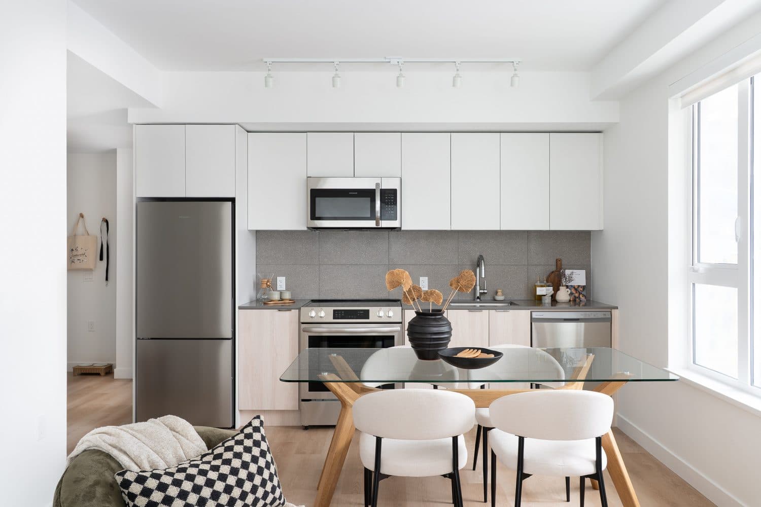 Kitchen and dining in a Westward home, with full-size appliances